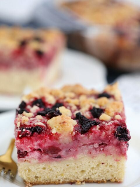 Cherry Cream Cheese Coffee Cake is made with a cake layer topped with a cheesecake filling, juicy cherries and a buttery crumb topping. #coffeecake #brunch #cherries #hissingcooker #desserts